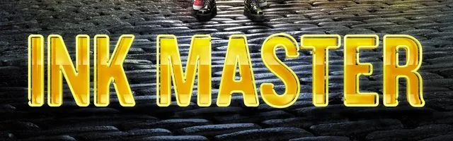 Glossy amber Ink Master lettering set into a wet black cobblestone street